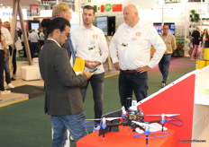 Luuk Jumelet and Martin Meuldijk explain Auxin at the corner of the Royal Brinkman booth that was focused on Auxin. In the foreground, a drone from Florinco that provides data to the platform Auxin.