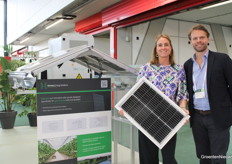 Marceline van Heijst and Rik van Ogtrop with Hermans Energy Solutions at the setup to show that you can have custom solar panels installed in your greenhouse roof.