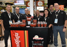 Team Red Sun Farms with the Sweetpops tomato display in front.